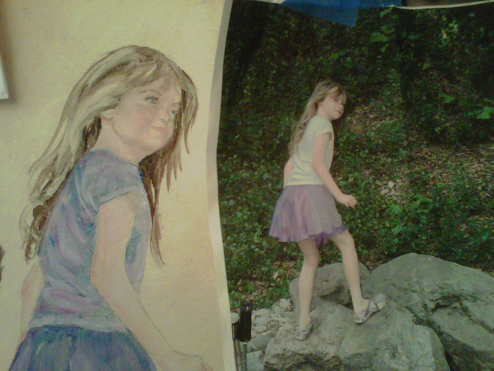 Hand Painted portrait from photo of a child on a children's wall with her dog & cat