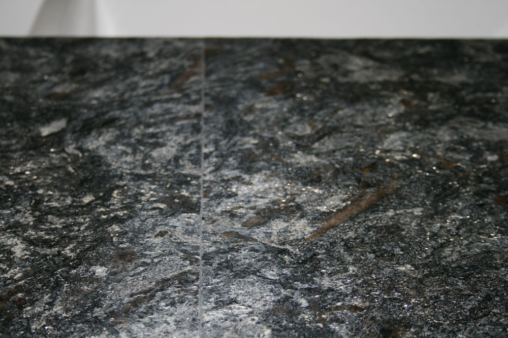Before: Granite - Two slabs not butted together enough- had a grout line to be disguised - Matched G
